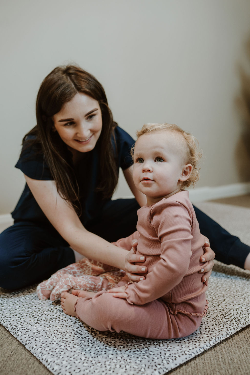 Osteopath Hannah Hilton treating a toddler