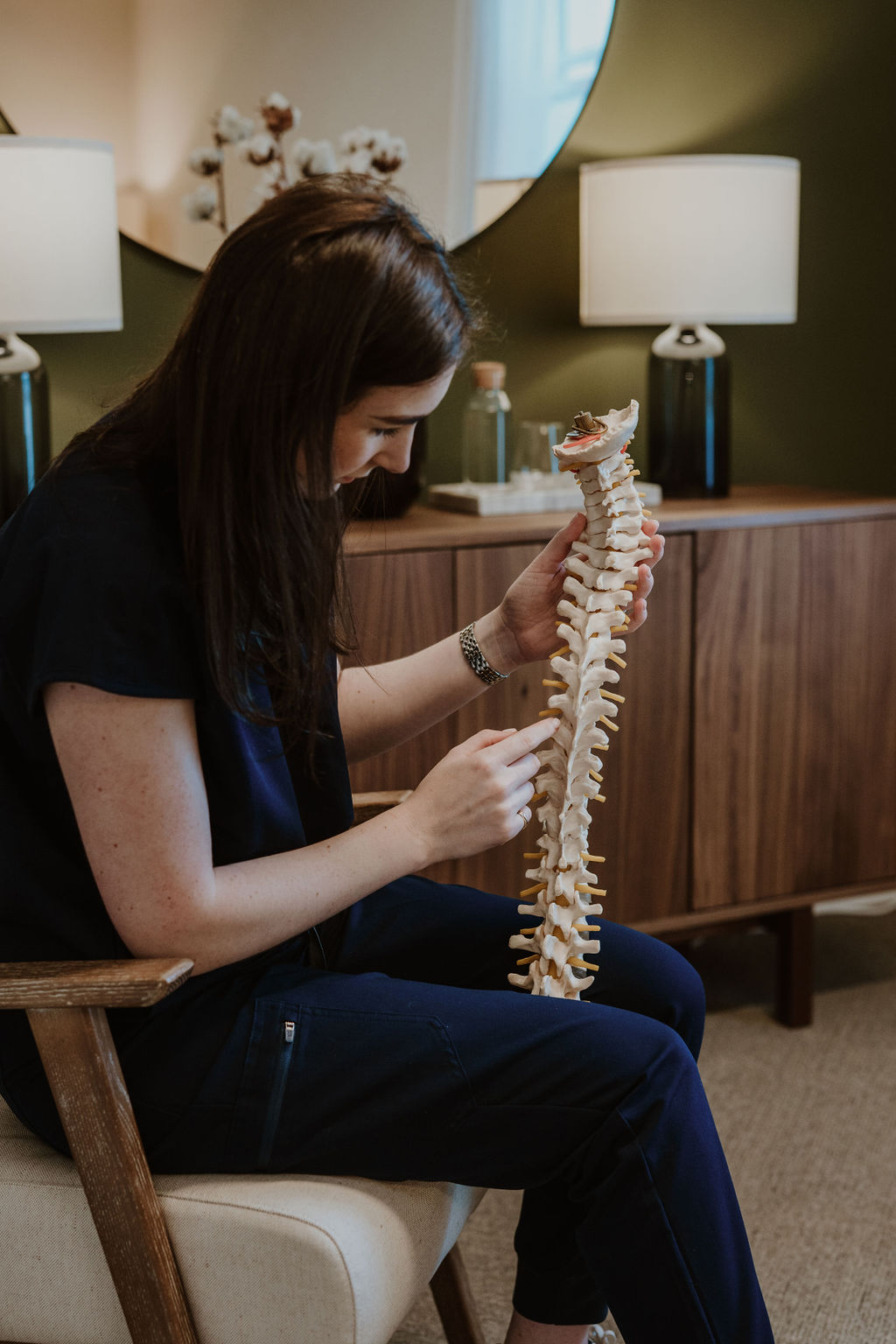 Osteopath Hannah Hilton explaining a spine